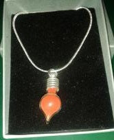 DIJE SANGRE DE DRAGON CON CADENA PLATA                    